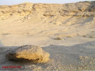 Artifacts from the Rohri Hills displayed against the backdrop of the site’s unique topography