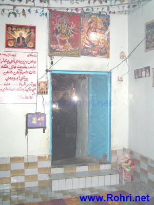 Ancient Cave Entrance of Kalka Devi Temple Sunlit rugged entrance of Kalka Devi Cave Temple nestled in the Kalka Hills, Rohri, Sindh, Pakistan