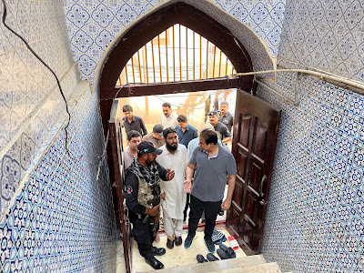 inspecting the Moe-e-Mubarak shrine after a theft attempt, expressing concern and planning next steps inspecting the Moe-e-Mubarak shrine after a theft attempt, expressing concern and planning next steps