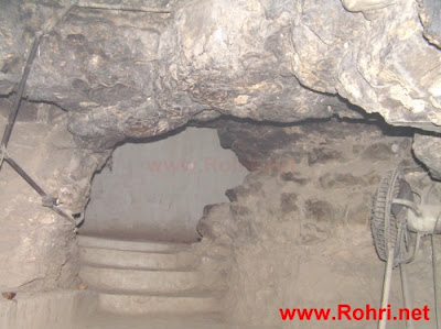 Sunrise Over Kalka Devi Temple Golden morning light bathing the ancient Kalka Devi Cave Temple entrance in Rohri, Sindh, Pakistan
