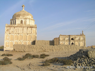 Red brick mosque constructed by Talpur dynasty at Qadir Bakhsh-jo-Qubo, featuring arched entrances Red brick mosque constructed by Talpur dynasty at Qadir Bakhsh-jo-Qubo, featuring arched entrances