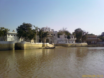 Sadh Belo Temple Complex on the Indus River Sadh Belo temple complex along the Indus River with a small boat at the riverside in Sukkur, Pakistan