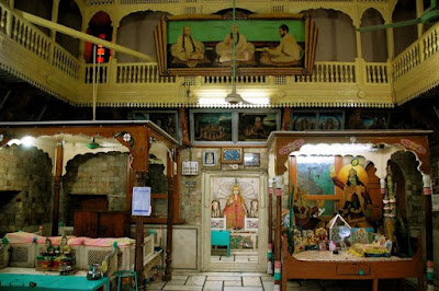 Sadh Belo Temple Interior with Sacred Shrines Interior of Sadh Belo temple showcasing ornate shrines and religious artwork in Sukkur, Pakistan