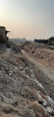 Ancient Passageway – Rohri’s Historic Route Ancient pathway through rocky terrain in Rohri, Sindh — historic route flanked by stone embankments, fading structures, and early infrastructure. A cultural trace of Sindh’s travel and trade legacy.